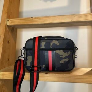 Camo crossbody with a detachable shoulder starap